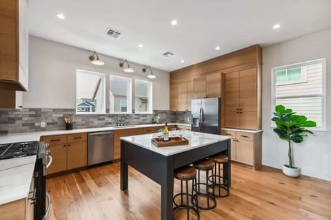 Modern Kitchen features 3-person bar