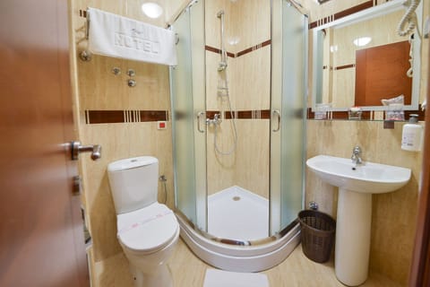 Shower, free toiletries, hair dryer, slippers