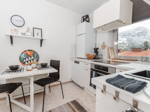 Furniture, Property, Cabinetry, Table, Countertop, Interior Design, Orange, Kitchen Stove, Home Appliance, Kitchen