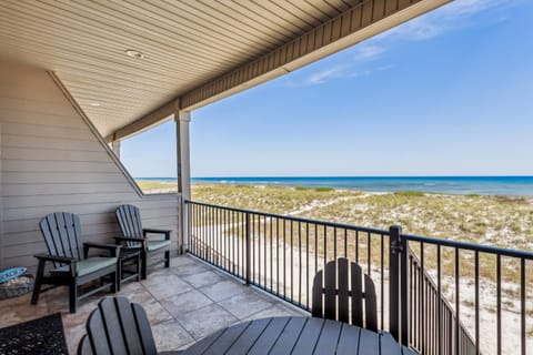 Private balcony off the living room just steps to the beach