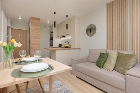 Living room with a comfortable sofa and TV. 
