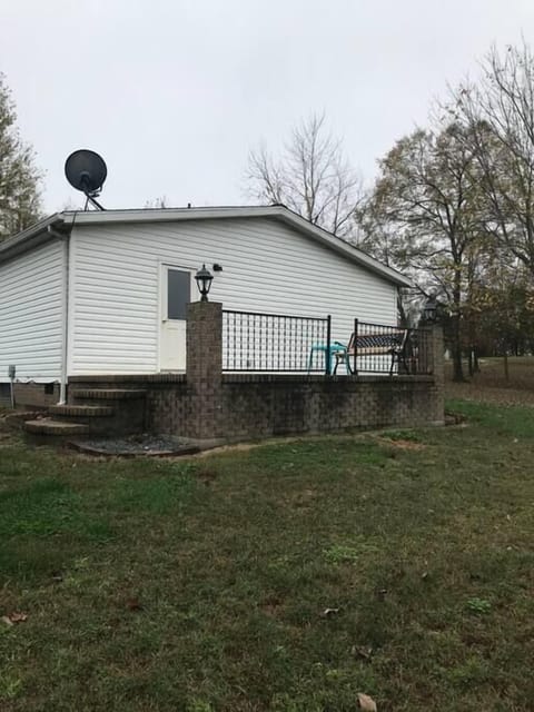Back Patio overlooking the firepit and picnic table. Also the goats over the fence. 