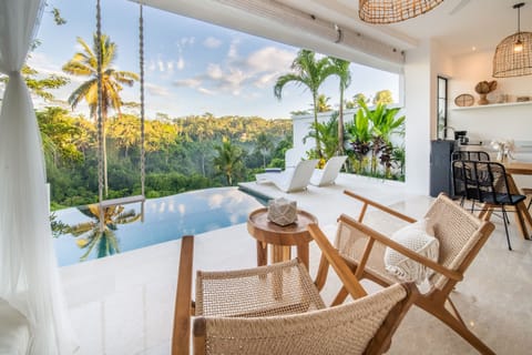 open space living room pool view and jungle view