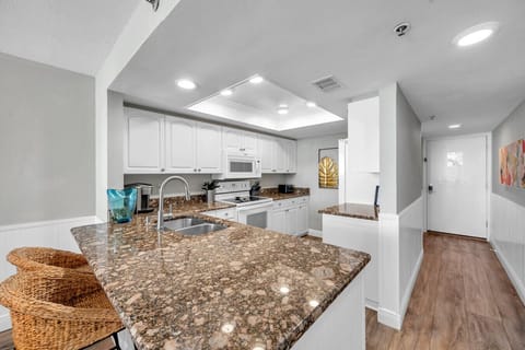 Kitchen counter detail w/ generous prep space, perfect for easy meals at home.