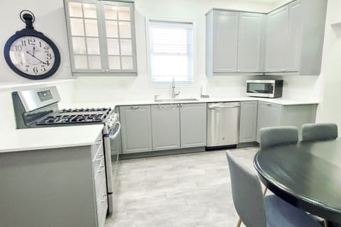 Open kitchen with dining table.