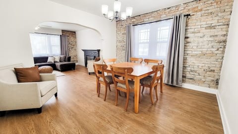 Dining room with exposed brick wall.