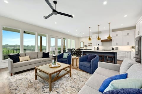 Spacious family lounge with big-screen TV and scenic lake views in Spicewood