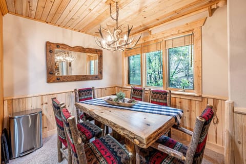 The adjoining dining room has a gorgeous dining room table that has seating for 6 guests.