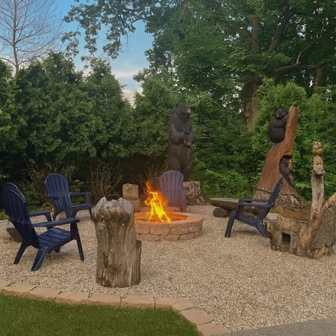 Cozy evening by the custom campfire, toasting marshmallows, chatting, and creating memories! The unique bear carvings will surely add some character to your stay at Bear's Lakeshore Lodge.