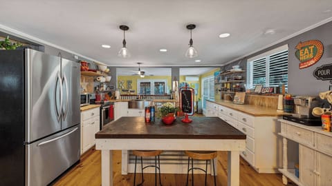 This open kitchen design is perfect for the chef in your group. Fully stocked kitchen includes all the appliances you need, a full-size refrigerator and plenty of counter space.