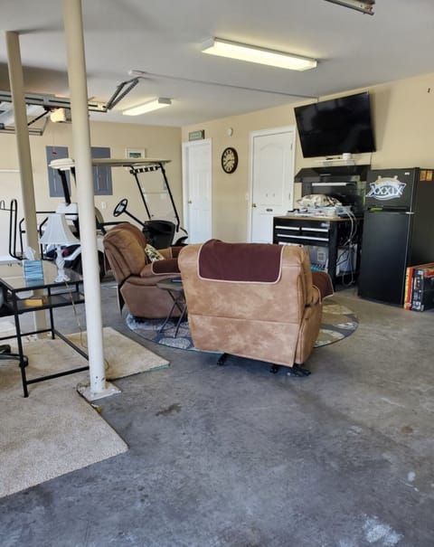 Put the men in the garage to watch the game! GOLF cart included