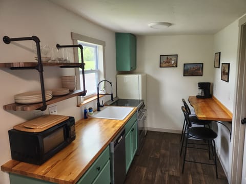 Kitchen: range, refrigerator, freezer, microwave, dishwasher, coffee maker.