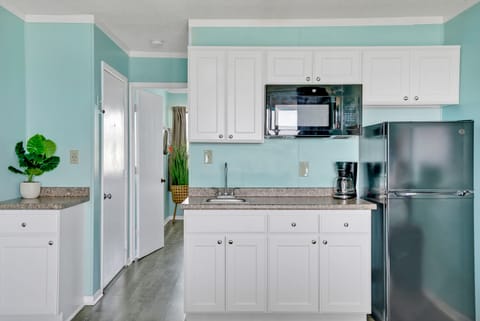 Fridge, microwave, coffee/tea maker, paper towels