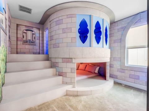 - Fairytale castle themed bedroom with built in bunk bed design  
- Unique vacation rental near Disney with magical décor for kids  
- Orlando family rental offering playful creative sleeping spaces