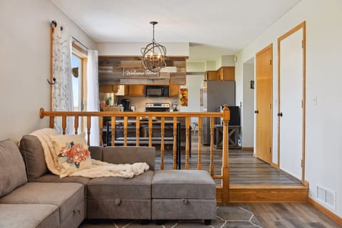 View of the living room, dining area, and kitchen.