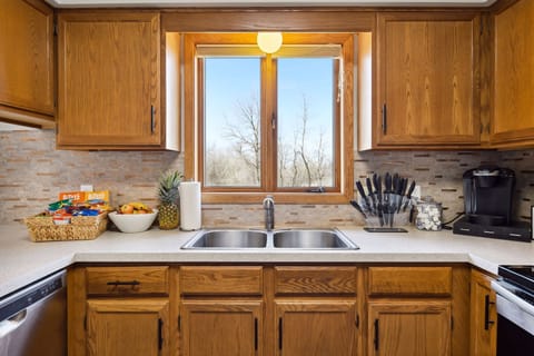 Kitchen: Complimentary snack basket, coffee bar, and beverage refrigerator.