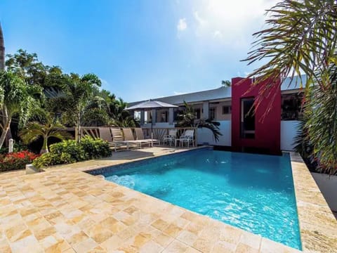 The pool area beckons with endless enjoyment and comfort.