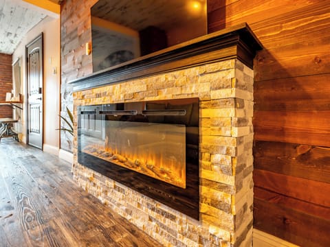 Loft, 1 Bedroom, City View | Living area | 75-inch Smart TV with digital channels, fireplace, Netflix