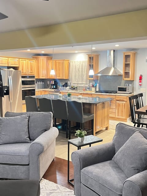 Kitchen, large island, stacked microwave and oven, common kitchen appliances