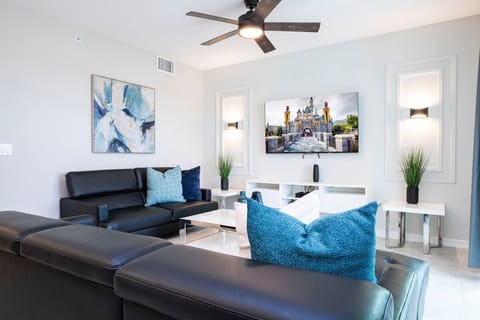 Step into this spacious, comfortable living area. The expansive room is adorned with tasteful decor, offering a blend of modern aesthetics and homey warmth. 