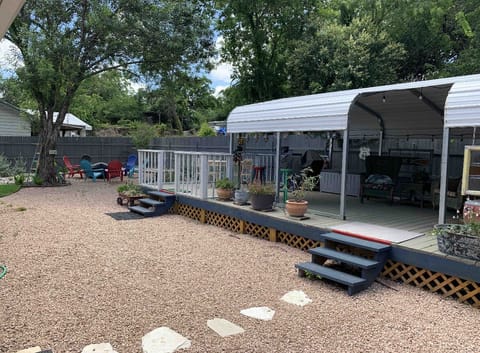 Backyard - propane grill, fire pit, covered seating.