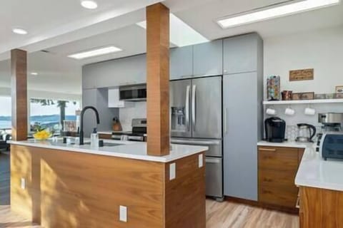 Kitchen adjacent to living room. Stop by the Coffee Corner for some tea, hot cocoa, or coffee.