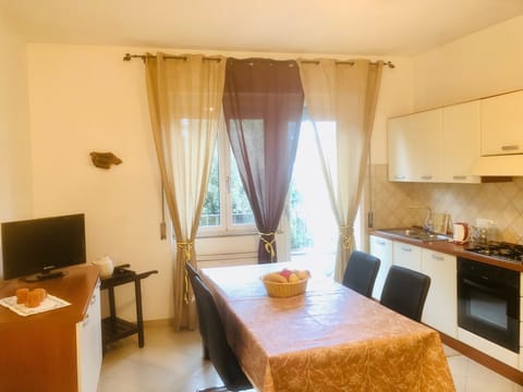 fully equipped kitchen with wide table for dining and working, balcony