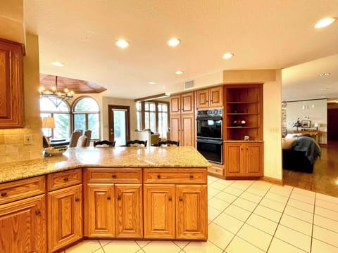 Large gathering Kitchen with bar and dining area