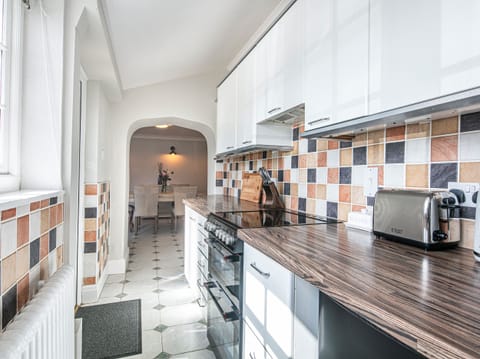 Fridge, electric kettle, toaster, cookware/dishes/utensils