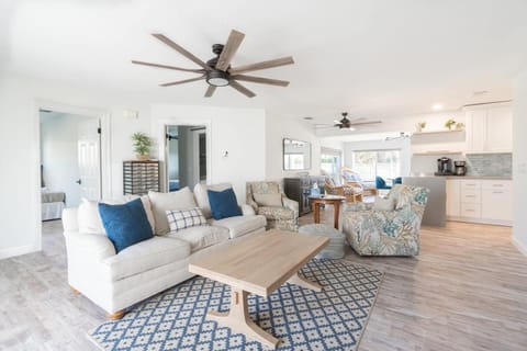 Kick back and relax in our cozy living room! ️ The perfect spot to unwind after a fun-filled day at the beach. You deserve this comfort! ️