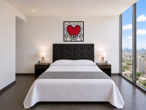 The master bedroom features a comfortable queen-size bed, providing a restful and cozy sleeping space for your ultimate comfort.