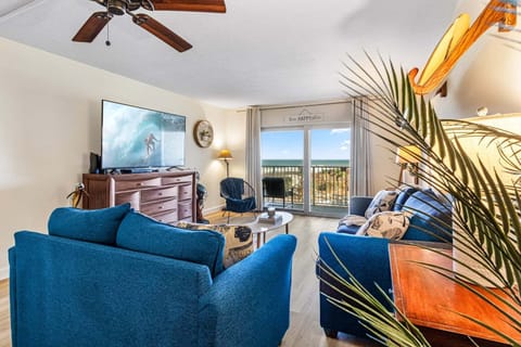 Bright and cozy living room with a stunning view of the oceanfront balcony