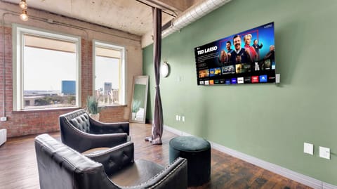 Living Room: Bright and stylish with city views, perfect for unwinding or binge-watching!