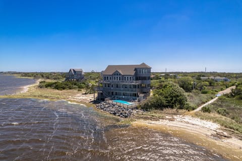 This unforgettable soundfront home in Frisco offers sweeping views of the Pamlico Sound and a peaceful Hatteras Island setting.