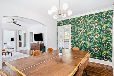 Dining room with seating for 6 at the dining table. The dining table also doubles as a ping pong table! Ping ping items located in the basket on the wall.