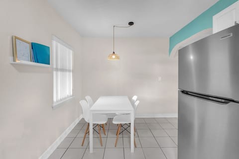 Dining area provides a cozy setting for your meals and can comfortably accommodate up to four people.