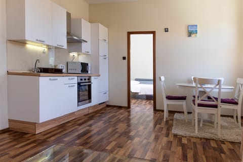 Full equipped kitchen and dining area.