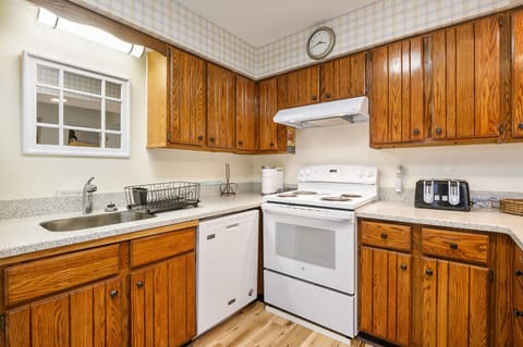 Warm Warm Cabinetry and lots of countertop space.