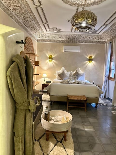 Suite Majestueuse(Malika) | Down comforters, pillowtop beds, in-room safe, individually decorated