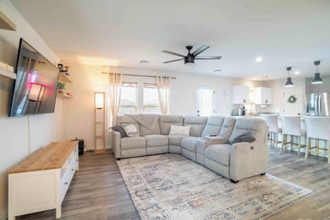 Comfortable reclining sofas with center console in living room. 