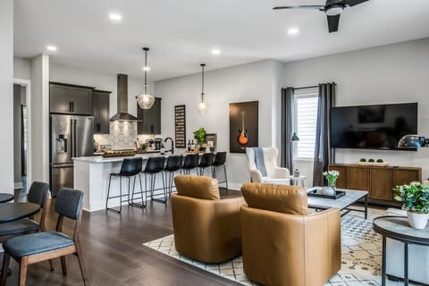 Modern open-concept space blending the kitchen and lounge.