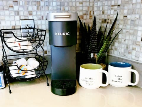 Coffee station with Keurig coffee maker.  Coffee and creamer are provided.