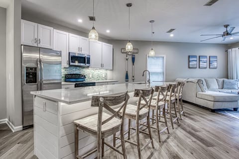 Kitchen island with seating for 5 and dining table with seating for 8