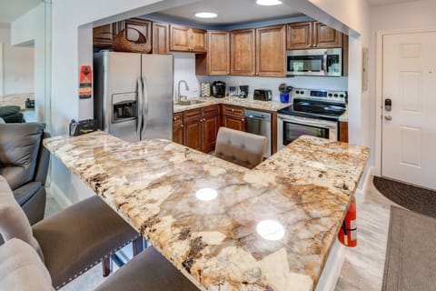 The updated kitchen boasts stainless steel appliances and beautiful granite countertops, enhancing both style and functionality.