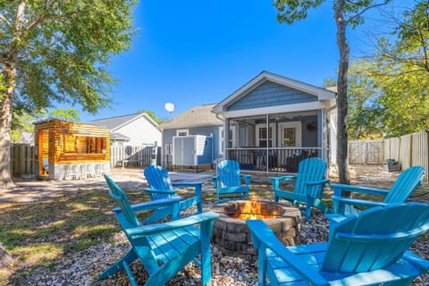 Gather around the fire pit in the backyard with Adirondack chairs for warmth, drinks, and good conversation.
