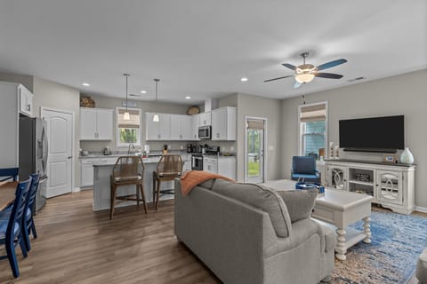 Spacious living room with entrance to back patio