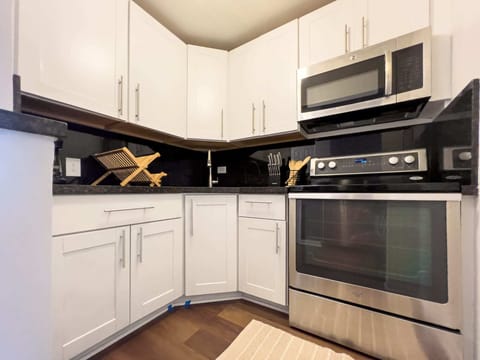Experience the joy of cooking in our compact, yet fully-functional kitchen, a space where convenience meets Miami chic.