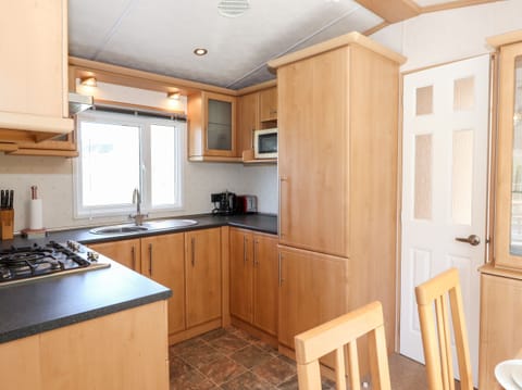 Fridge, electric kettle, toaster, cookware/dishes/utensils