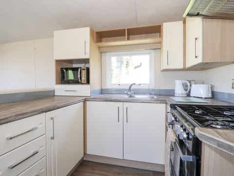 Fridge, electric kettle, toaster, cookware/dishes/utensils