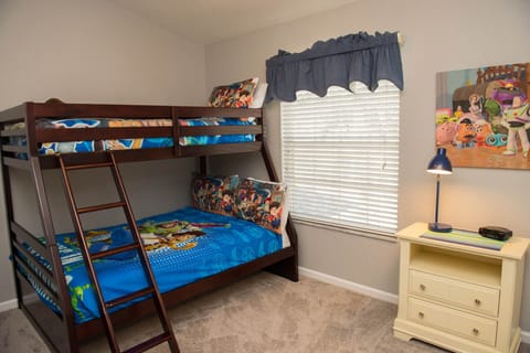 Twin over full Toy Story bunk room with attached bath